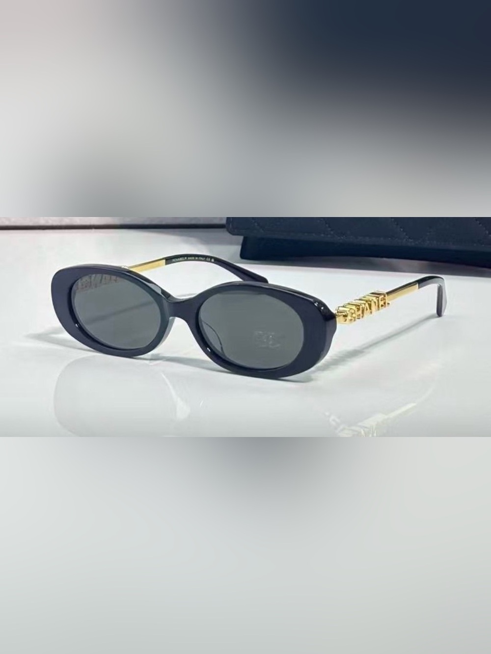 Black Oval Sunglasses with gold metal